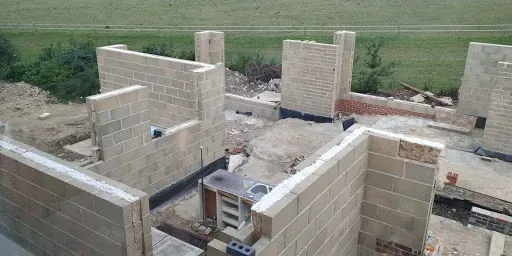 New blockwork walls rising from fresh foundations